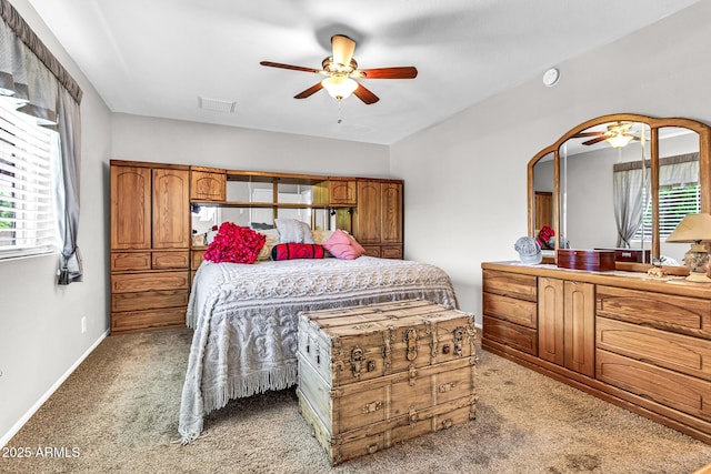 6055 E Hannibal St, Mesa, AZ 85205 - bedroom with light carpet and ceiling fan