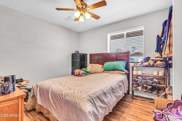 6055 E Hannibal St, Mesa, AZ 85205 - bedroom featuring wood finished floors and a ceiling fan