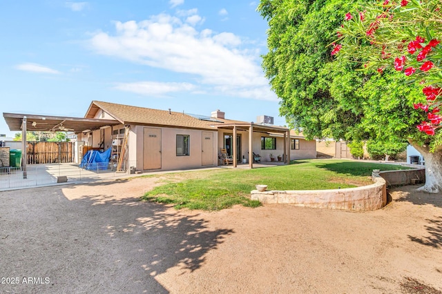 6055 E Hannibal St, Mesa, AZ 85205 - rear view of property featuring a patio, stucco siding, and a chimney