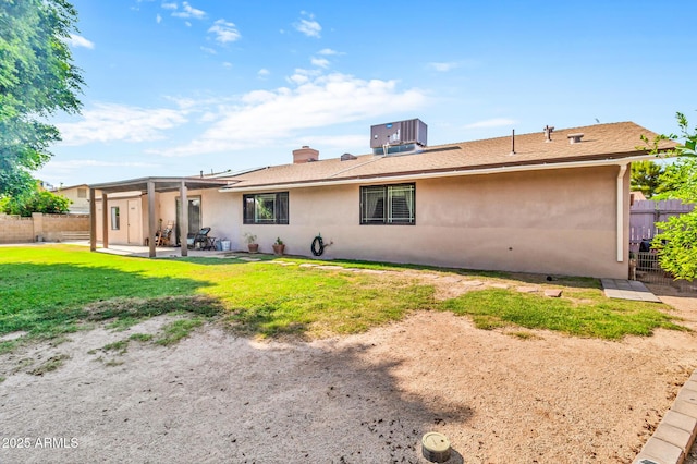 6055 E Hannibal St, Mesa, AZ 85205 - back of property with stucco siding, a patio area, and a chimney