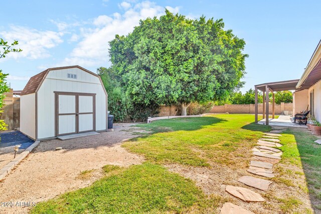 6055 E Hannibal St, Mesa, AZ 85205 - fenced backyard with a storage shed and a patio area