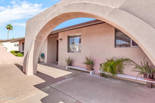 6055 E Hannibal St, Mesa, AZ 85205 - doorway to property featuring a patio and stucco siding