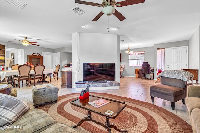 6055 E Hannibal St, Mesa, AZ 85205 - living room featuring a ceiling fan and light tile patterned flooring