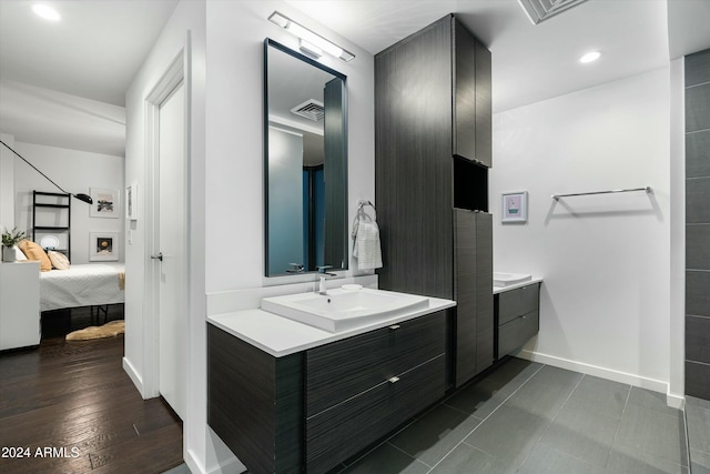 bathroom featuring vanity and wood-type flooring