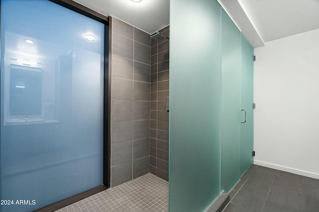 bathroom featuring a tile shower and tile patterned floors