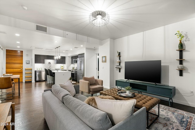 living room with dark hardwood / wood-style flooring