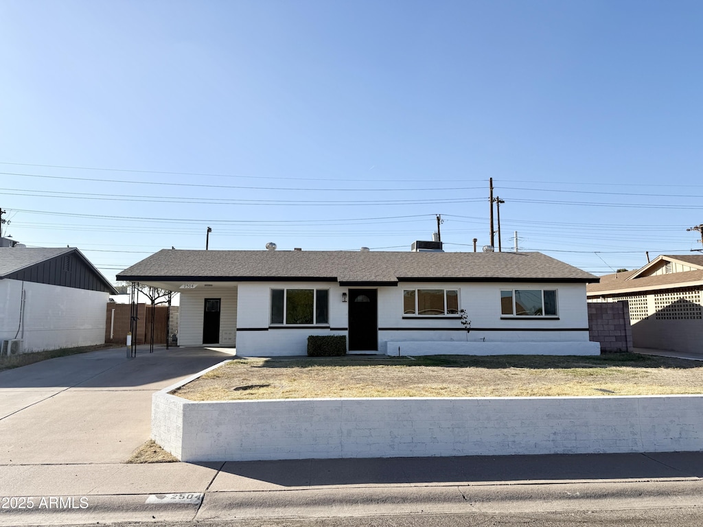 ranch-style house with a carport