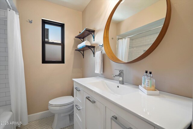 1939 E Solano Dr, Phoenix, AZ 85016 - full bathroom featuring baseboards, toilet, and vanity
