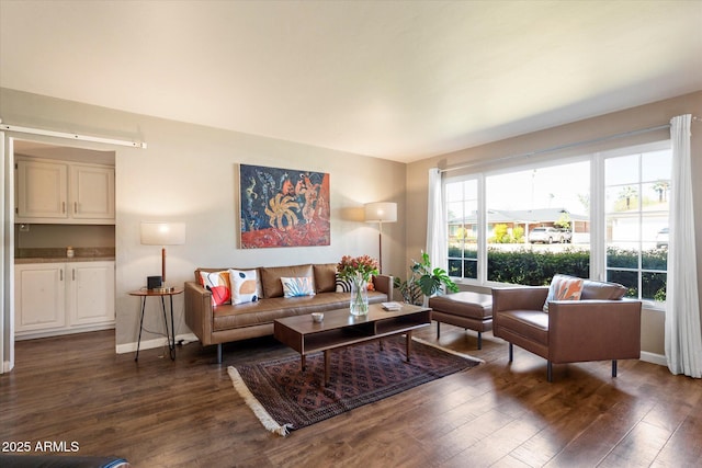 1939 E Solano Dr, Phoenix, AZ 85016 - living room featuring dark wood finished floors and baseboards