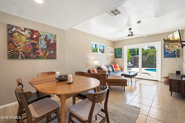 1939 E Solano Dr, Phoenix, AZ 85016 - dining area featuring baseboards, a wall mounted air conditioner, visible vents, and a ceiling fan