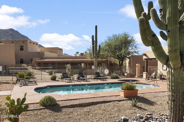 38065 N Cave Creek Rd Unit 4, Cave Creek, AZ 85331 - community pool featuring fence, a community hot tub, and a patio area