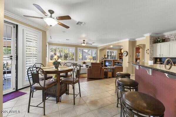 tiled dining area with ornamental molding