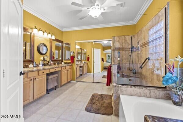 bathroom featuring tile patterned floors, ornamental molding, vanity, independent shower and bath, and ceiling fan