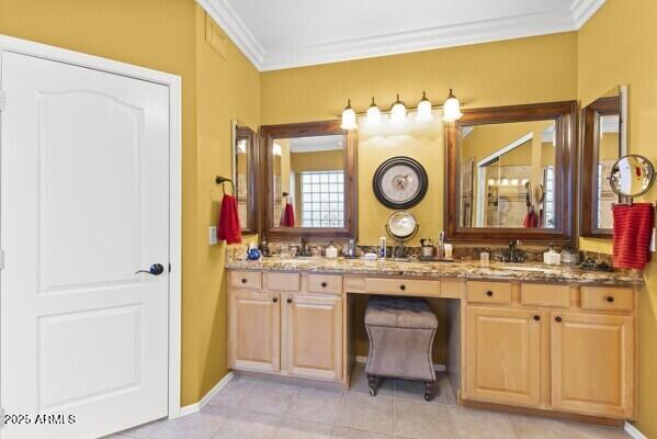 bathroom with vanity, crown molding, and tile patterned floors