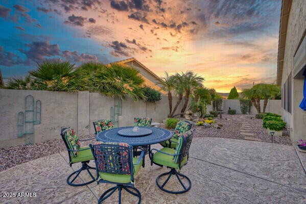 view of patio terrace at dusk