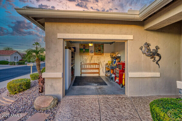 view of exterior entry at dusk