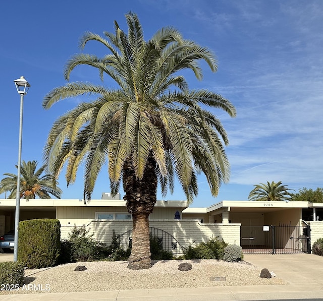 view of front of home with a carport