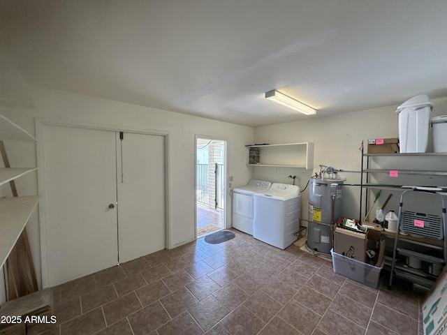 clothes washing area with independent washer and dryer and water heater