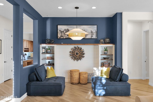 sitting room with light hardwood / wood-style floors