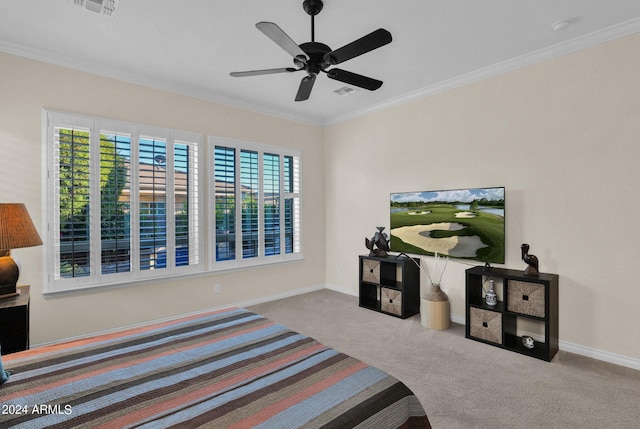 bedroom featuring ceiling fan, ornamental molding, light carpet, and multiple windows