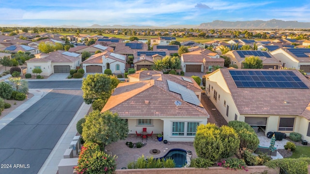 birds eye view of property with a mountain view