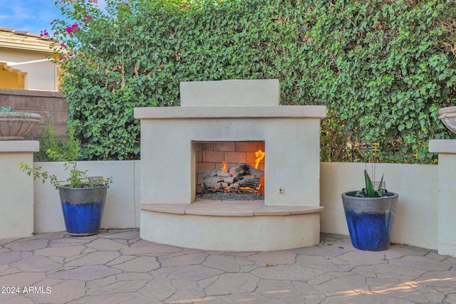 view of patio featuring an outdoor fireplace