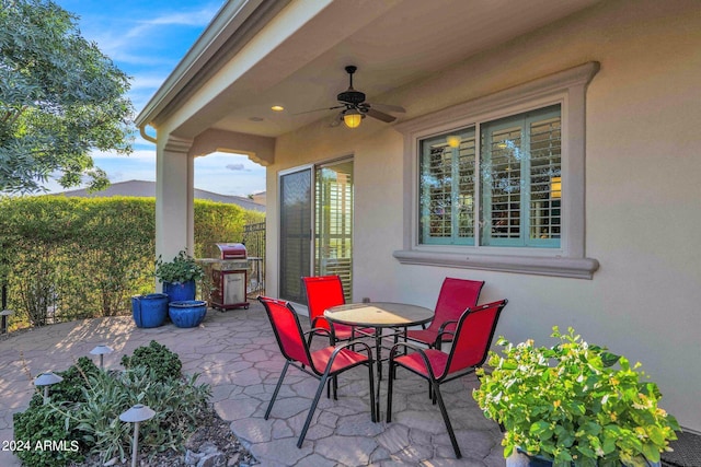 view of patio / terrace with ceiling fan and a grill