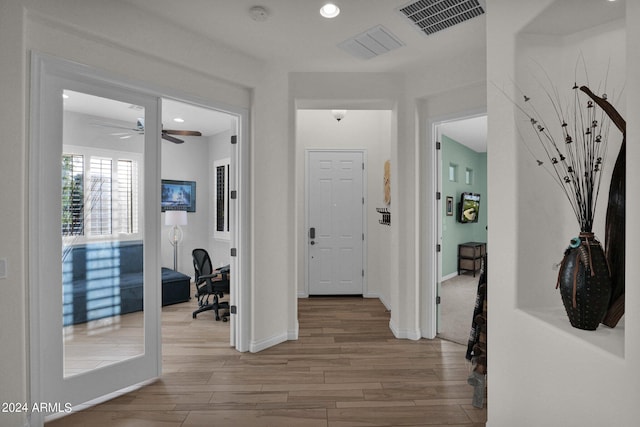 hall with light wood-type flooring