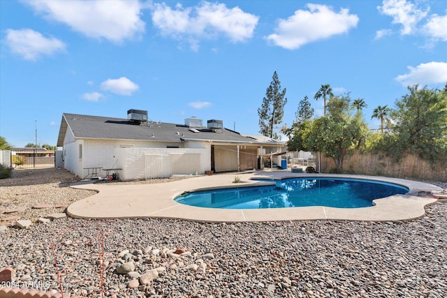 view of swimming pool with a patio area and central AC