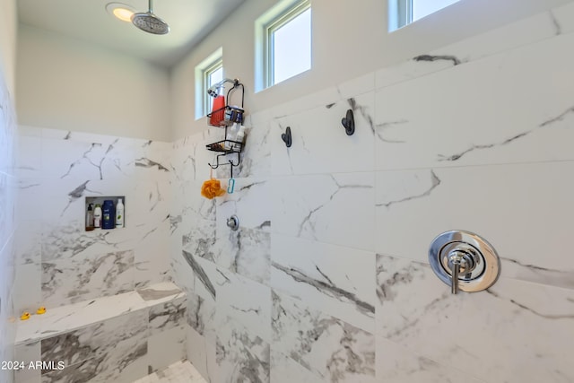 bathroom featuring a tile shower