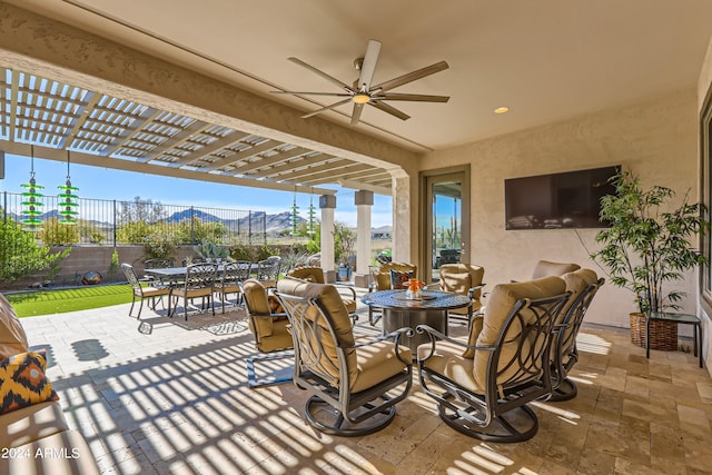 view of patio featuring ceiling fan and a pergola