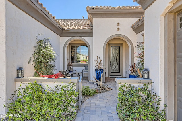 doorway to property with a patio area