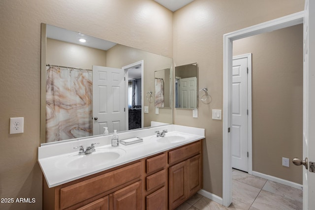 4230 W Palace Station Rd, New River, AZ 85087 - bathroom featuring double vanity and baseboards