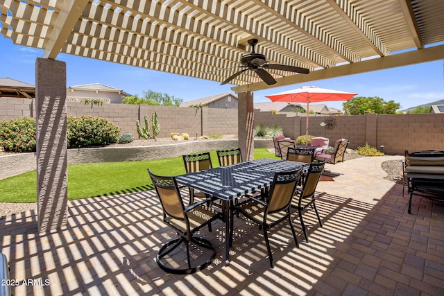 4230 W Palace Station Rd, New River, AZ 85087 - fenced backyard with outdoor dining space, a pergola, ceiling fan, and a patio
