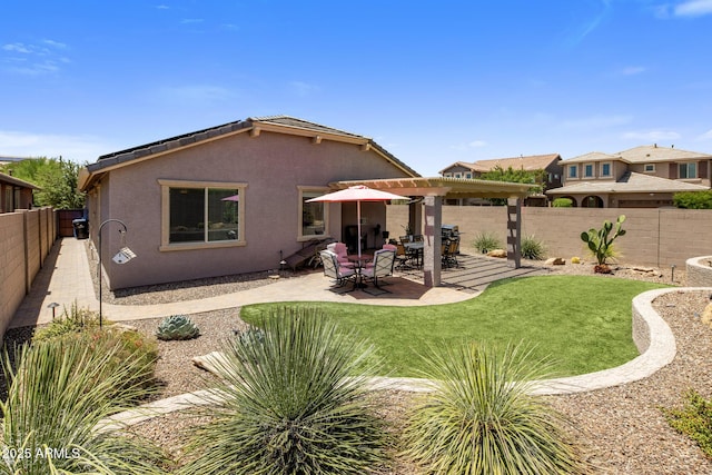 4230 W Palace Station Rd, New River, AZ 85087 - back of house with stucco siding, a fenced backyard, and a patio