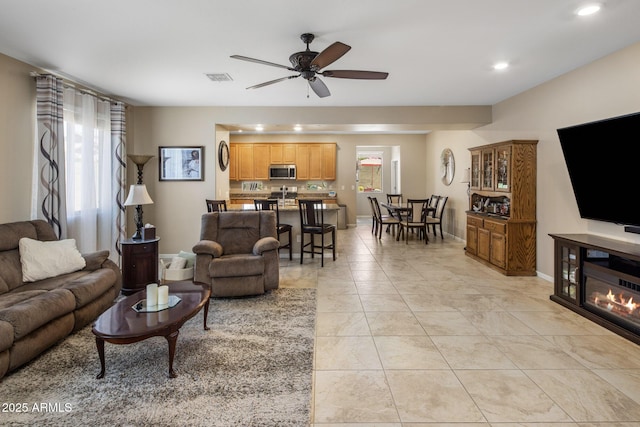 4230 W Palace Station Rd, New River, AZ 85087 - living room with a ceiling fan, healthy amount of natural light, recessed lighting, and light tile patterned floors