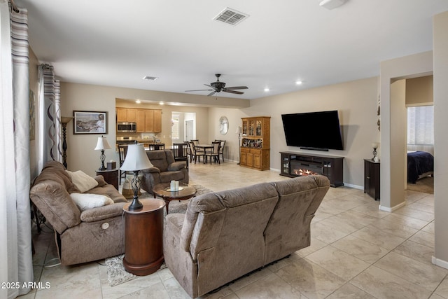 4230 W Palace Station Rd, New River, AZ 85087 - living area featuring a ceiling fan, recessed lighting, healthy amount of natural light, and light tile patterned flooring