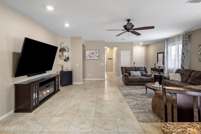 4230 W Palace Station Rd, New River, AZ 85087 - living area featuring a ceiling fan, recessed lighting, and a glass covered fireplace