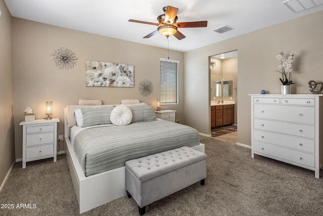 4230 W Palace Station Rd, New River, AZ 85087 - bedroom with carpet flooring, ensuite bathroom, and a ceiling fan