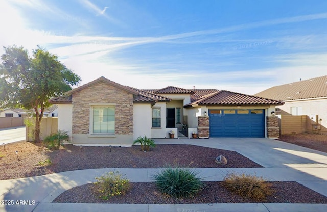 view of front facade with a tiled roof, stone siding, a garage, concrete driveway, and stucco siding