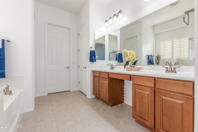 bathroom featuring double vanity, tile patterned floors, a garden tub, visible vents, and a sink
