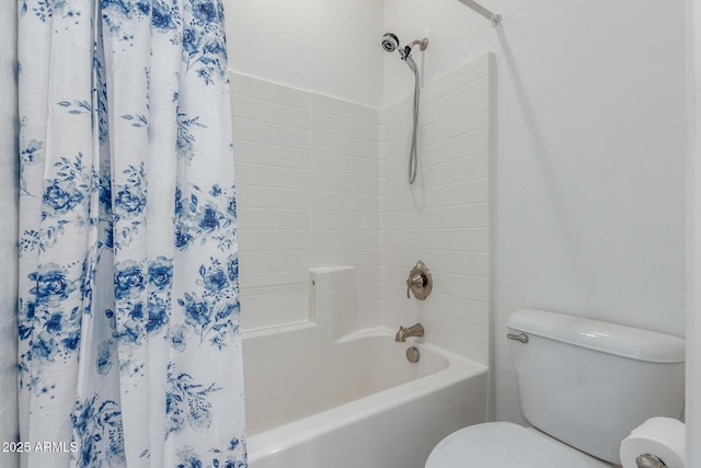 full bath featuring shower / tub combo and toilet