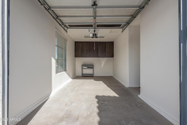 garage featuring baseboards and a garage door opener