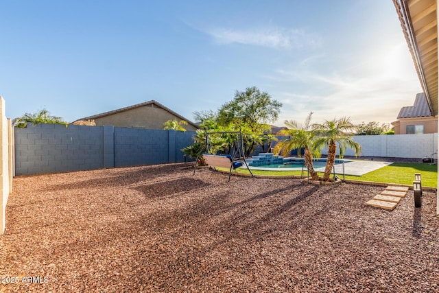 view of yard featuring a patio area, a fenced backyard, and a fenced in pool