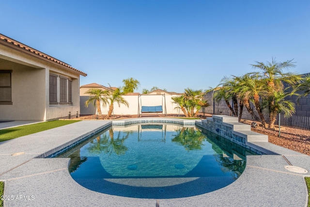 view of pool with a fenced backyard and a fenced in pool