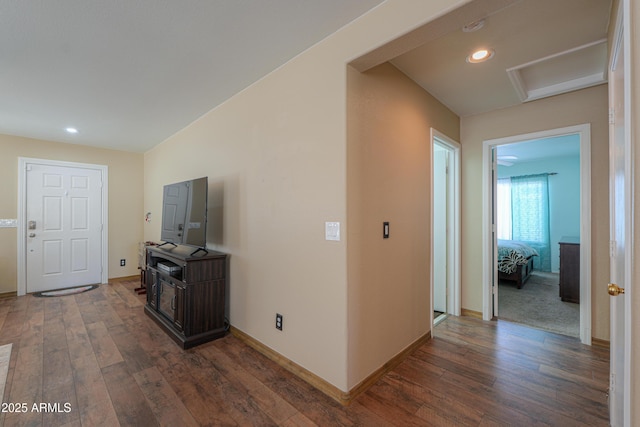 hallway with dark hardwood / wood-style flooring