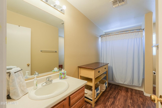 bathroom featuring vanity and hardwood / wood-style flooring