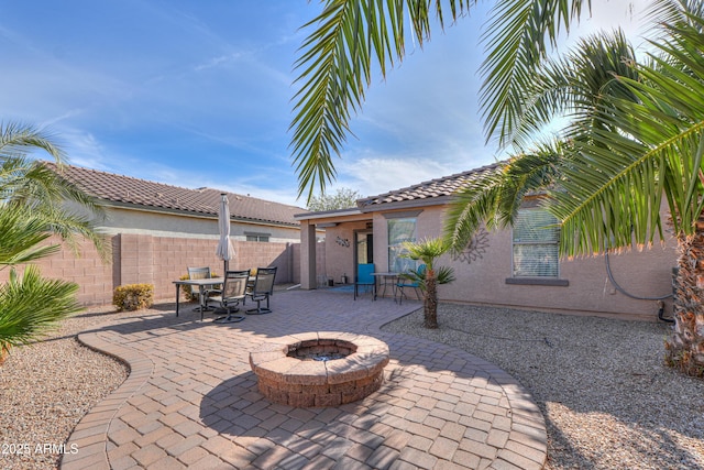 view of patio / terrace featuring a fire pit