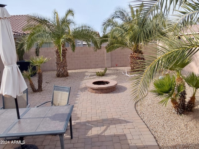 view of patio featuring a fire pit