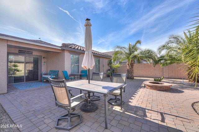 view of patio featuring a fire pit